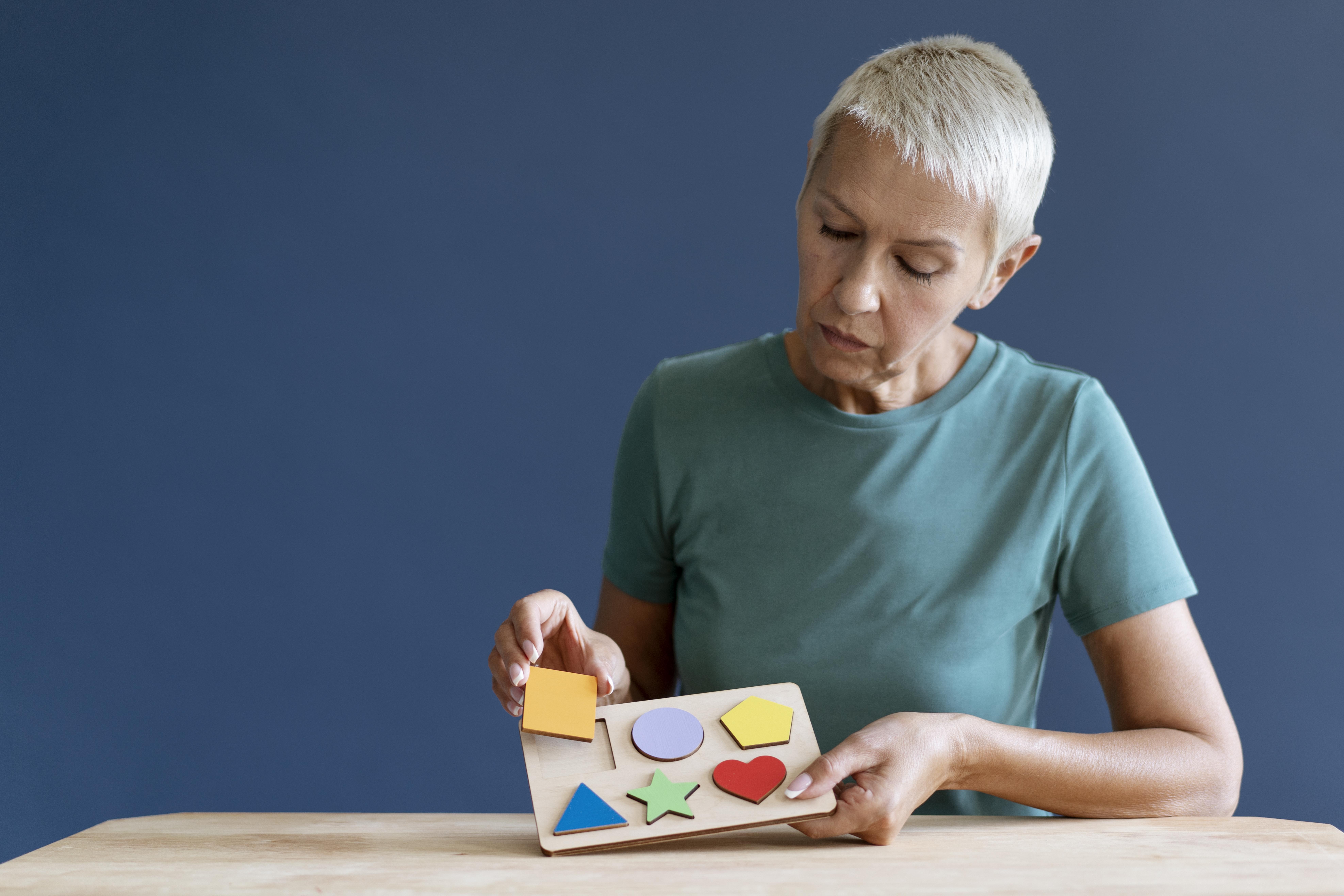 Home 124 mature woman having occupational therapy session 1